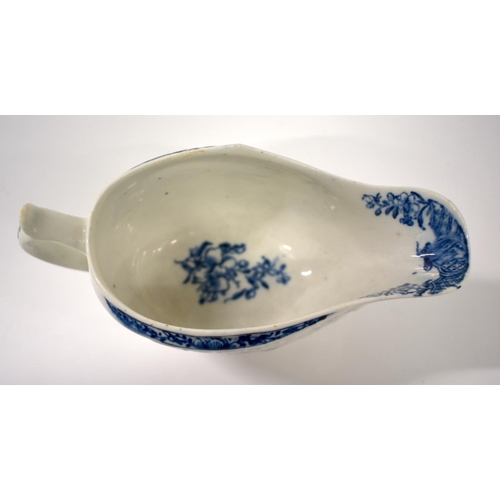 250 - 18th century Lowestoft floral moulded sauceboat painted and printed with in underglaze blue with flo... 