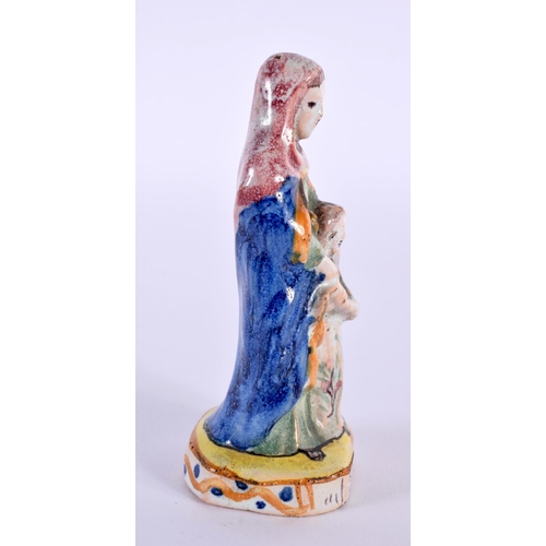 26 - AN ANTIQUE FRENCH FAIENCE TIN GLAZED POTTERY FIGURE OF ST ANNE. 9.5 cm high.