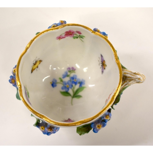 261 - 19th century Meissen floral encrusted cup and saucer painted with flowers and insects, crossed sword... 