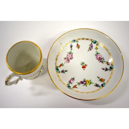 264 - 18th century Bristol coffee cup and saucer with moulded basket weave border painted with floral swag... 