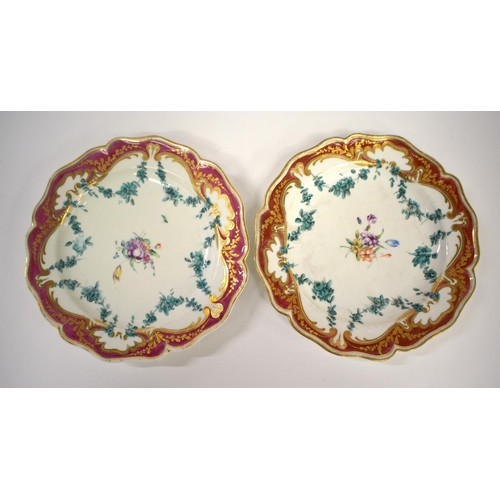 271 - Chelsea Derby lobed oval dish and a pair of plates painted with a central spray of flowers and green... 