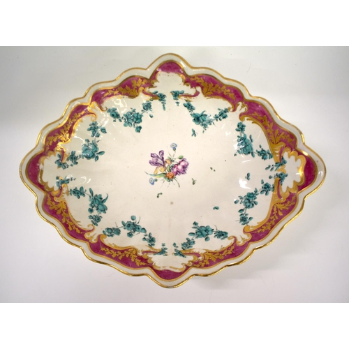 271 - Chelsea Derby lobed oval dish and a pair of plates painted with a central spray of flowers and green... 