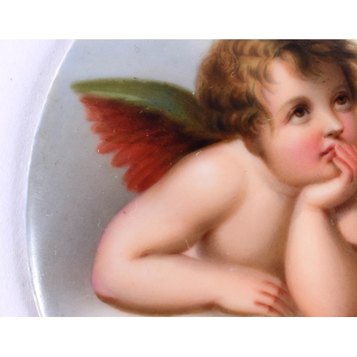 28 - AN ANTIQUE GERMAN PORCELAIN CHERUB PLAQUE. 8.5 cm x 6.5 cm.