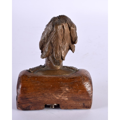 300 - A LATE 19TH CENTURY GRAND TOUR BRONZE BUST OF A MILITARY MALE modelled upon an oak plinth. 12 cm x 8... 