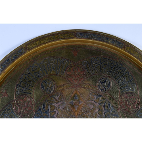 303 - A 19TH CENTURY MIDDLE EASTERN CAIRO WARE SILVER PLATED BRASS TRAY decorated with figures. 50 cm diam... 