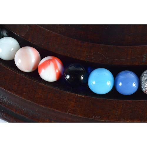 31 - A SOLITAIRE MARBLE BOARD with marbles. 32 cm diameter. (qty)