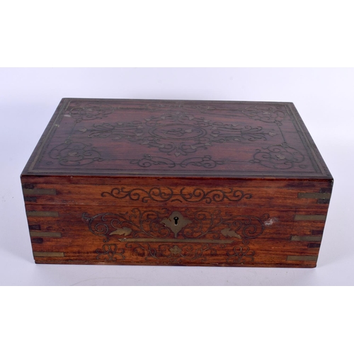 310 - AN ANGLO INDIAN ROSEWOOD BRASS INLAID JEWELLERY BOX decorated with foliage and vines. 30cm x 20cm.