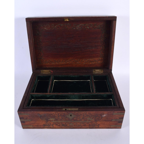 310 - AN ANGLO INDIAN ROSEWOOD BRASS INLAID JEWELLERY BOX decorated with foliage and vines. 30cm x 20cm.