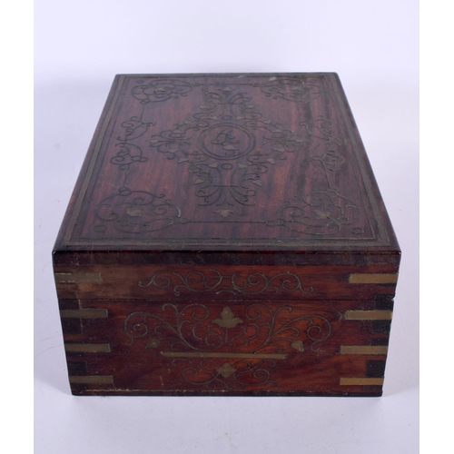 310 - AN ANGLO INDIAN ROSEWOOD BRASS INLAID JEWELLERY BOX decorated with foliage and vines. 30cm x 20cm.