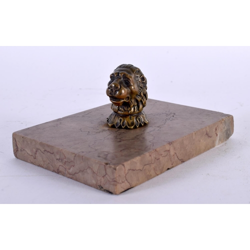 311 - AN 18TH CENTURY ENGLISH BRONZE AND MARBLE DESK STAND PAPERWEIGHT formed as a lion mask head. 13 cm x... 