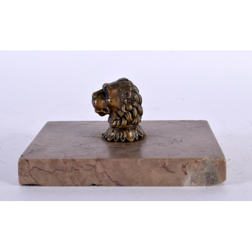 311 - AN 18TH CENTURY ENGLISH BRONZE AND MARBLE DESK STAND PAPERWEIGHT formed as a lion mask head. 13 cm x... 