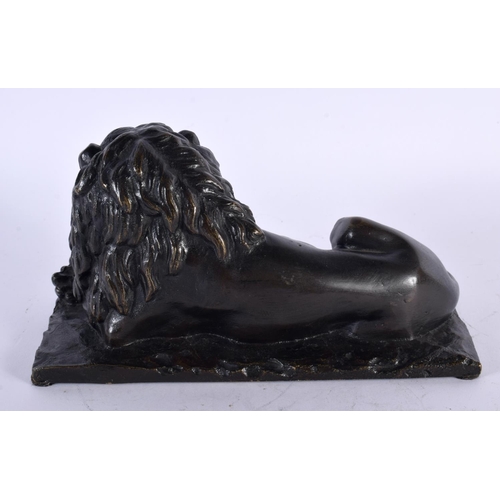 312 - A LOVELY EARLY 19TH CENTURY REGENCY BRONZE MODEL OF A recumbent LION modelled upon a naturalistic ba... 