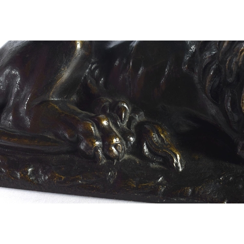 312 - A LOVELY EARLY 19TH CENTURY REGENCY BRONZE MODEL OF A recumbent LION modelled upon a naturalistic ba... 