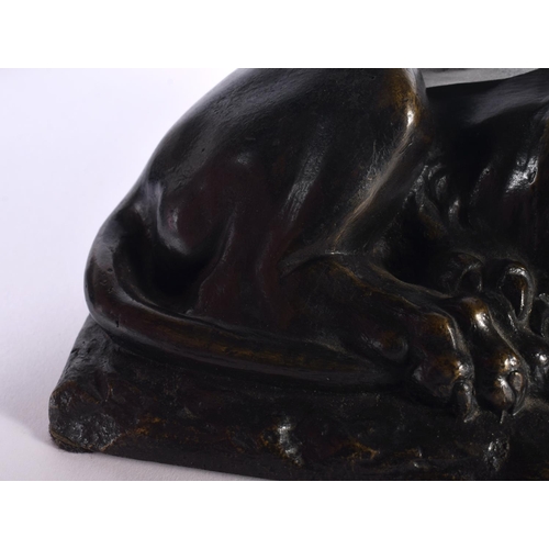 312 - A LOVELY EARLY 19TH CENTURY REGENCY BRONZE MODEL OF A recumbent LION modelled upon a naturalistic ba... 