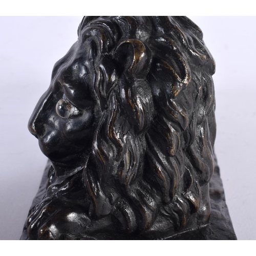 312 - A LOVELY EARLY 19TH CENTURY REGENCY BRONZE MODEL OF A recumbent LION modelled upon a naturalistic ba... 