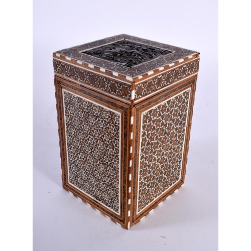 318 - A 19TH CENTURY MIDDLE EASTERN SILVER INLAID MICRO MOSAIC TEA CADDY AND COVER decorated with figures.... 