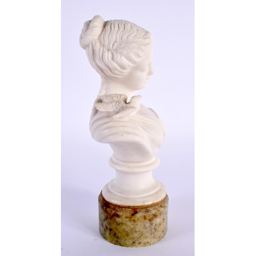 32 - AN EARLY 20TH CENTURY PARIAN WARE BUST OF A FEMALE modelled with a bird on her shoulder. 15cm high.