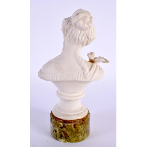 32 - AN EARLY 20TH CENTURY PARIAN WARE BUST OF A FEMALE modelled with a bird on her shoulder. 15cm high.