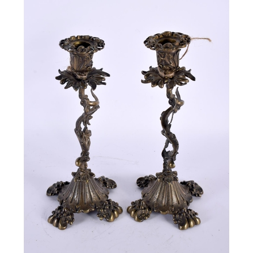 322 - A PAIR OF 19TH CENTURY EUROPEAN BRONZE CANDLESTICKS formed with entwined vines and foliage. 25 cm hi... 