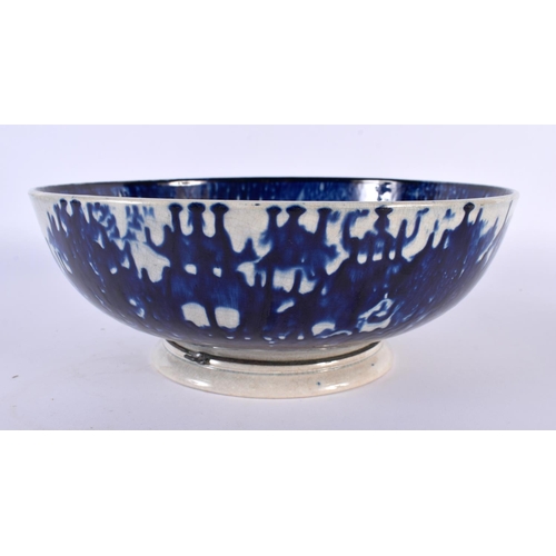 33 - AN EARLY 19TH CENTURY ENGLISH FLOW BLUE PEARLWARE BOWL painted with landscapes. 22cm diameter.