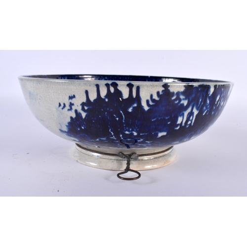 33 - AN EARLY 19TH CENTURY ENGLISH FLOW BLUE PEARLWARE BOWL painted with landscapes. 22cm diameter.