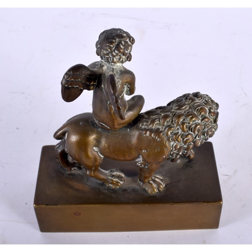 335 - A LOVELY EARLY 19TH CENTURY ENGLISH REGENCY BRONZE INKWELL depicting a winged boy riding upon a lion... 