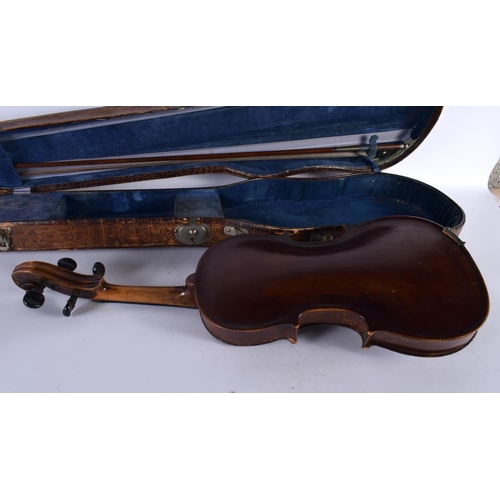 343 - A CASED SINGLE PIECE BACK VIOLIN together with a bow. Violin 57 cm long, length of back 35.5 cm. (2)