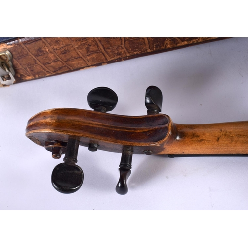 343 - A CASED SINGLE PIECE BACK VIOLIN together with a bow. Violin 57 cm long, length of back 35.5 cm. (2)