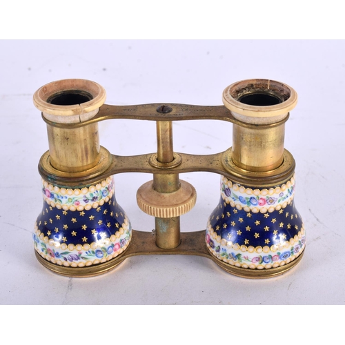 345 - A PAIR OF ANTIQUE J H STEWARD ENAMEL OPERA GLASSES painted with flowers and star shaped motifs. 7cm ... 