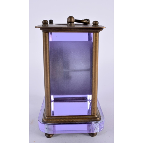 351 - A VERY UNUSUAL EARLY 20TH CENTURY FRENCH BRASS AND AMETHYST GLASS CLOCK with circular enamel dial. 1... 