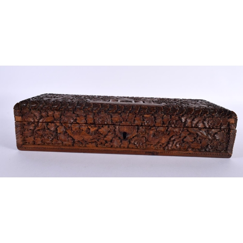 352 - A FINE 19TH CENTURY INDIAN CARVED SANDALWOOD RECTANGULAR CASKET decorated all over with animals in e... 