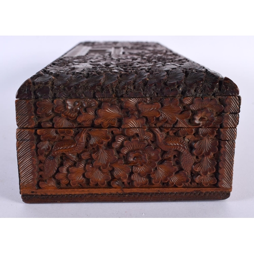 352 - A FINE 19TH CENTURY INDIAN CARVED SANDALWOOD RECTANGULAR CASKET decorated all over with animals in e... 