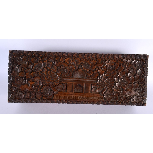 352 - A FINE 19TH CENTURY INDIAN CARVED SANDALWOOD RECTANGULAR CASKET decorated all over with animals in e... 