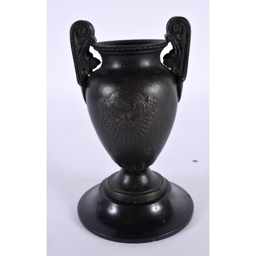 356 - A 19TH CENTURY EUROPEAN TWIN HANDLED GRAND TOUR BRONZE URN After the Antiquity, decorated with bold ... 