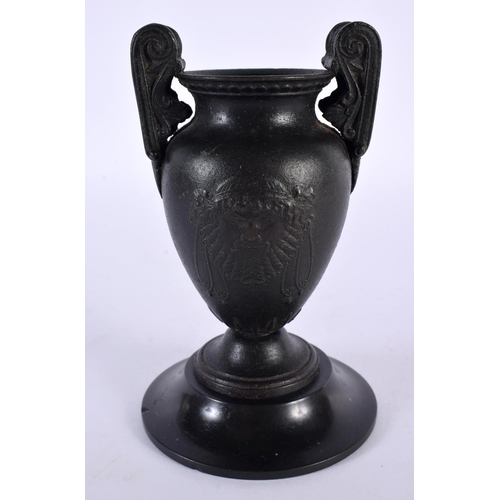 356 - A 19TH CENTURY EUROPEAN TWIN HANDLED GRAND TOUR BRONZE URN After the Antiquity, decorated with bold ... 