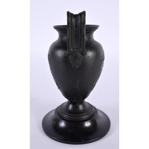 356 - A 19TH CENTURY EUROPEAN TWIN HANDLED GRAND TOUR BRONZE URN After the Antiquity, decorated with bold ... 