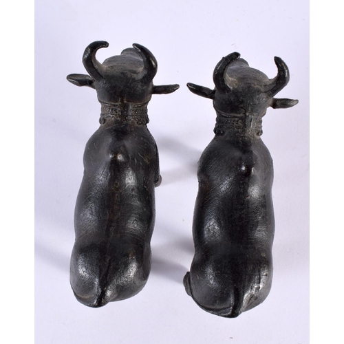 358 - A PAIR OF 18TH/19TH CENTURY INDIAN BRONZE FIGURES OF NANDI BULLS modelled roaming. 11cm x 8 cm.