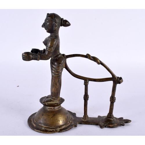 359 - AN UNUSUAL 18TH CENTURY INDIAN BRONZE FIGURE OF A STANDING DEITY modelled holding two open cups. 14c... 