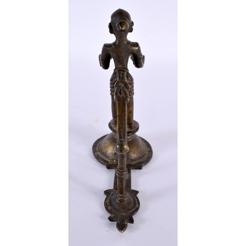 359 - AN UNUSUAL 18TH CENTURY INDIAN BRONZE FIGURE OF A STANDING DEITY modelled holding two open cups. 14c... 