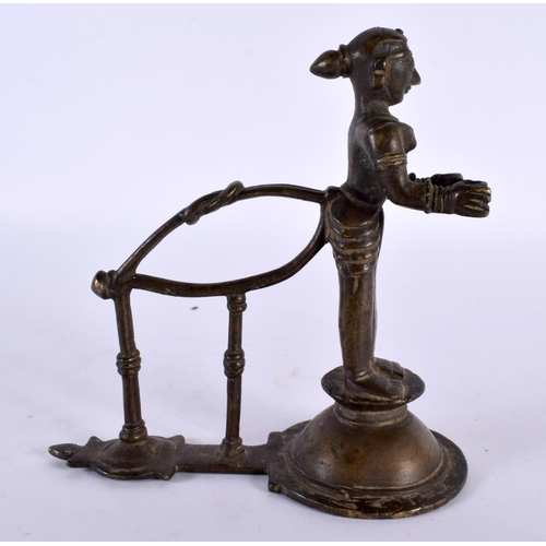 359 - AN UNUSUAL 18TH CENTURY INDIAN BRONZE FIGURE OF A STANDING DEITY modelled holding two open cups. 14c... 