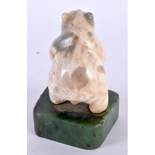 360 - A VINTAGE NORTH AMERICAN CARVED JADE AND STONE FIGURE OF A POLAR BEAR modelled with a fish within it... 