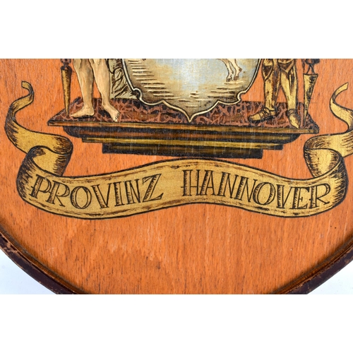 366 - A CONTINENTAL GERMAN ARMORIAL PAINTED HANNOVER COAT OF ARMS WOOD SHIELD. 44 cm x 34 cm.