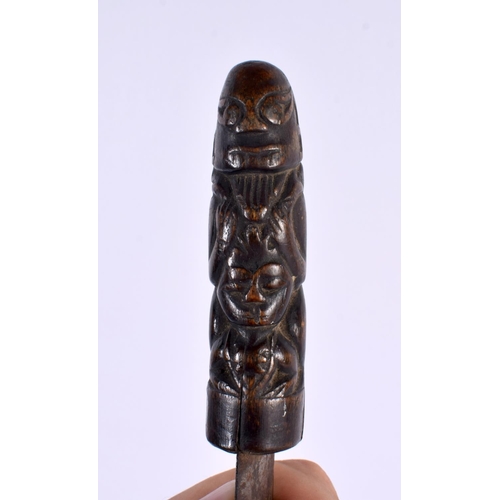 369 - A 19TH CENTURY MIDDLE EASTERN ASIAN CARVED RHINOCEROS HORN DAGGER formed with tribal figures. 28cm l... 