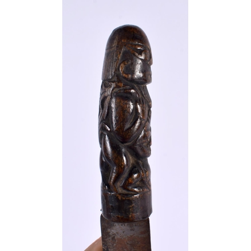 369 - A 19TH CENTURY MIDDLE EASTERN ASIAN CARVED RHINOCEROS HORN DAGGER formed with tribal figures. 28cm l... 