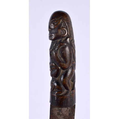 369 - A 19TH CENTURY MIDDLE EASTERN ASIAN CARVED RHINOCEROS HORN DAGGER formed with tribal figures. 28cm l... 