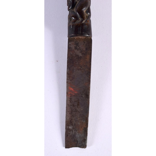 369 - A 19TH CENTURY MIDDLE EASTERN ASIAN CARVED RHINOCEROS HORN DAGGER formed with tribal figures. 28cm l... 