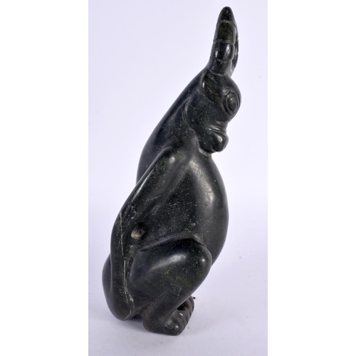 388 - AN UNUSUAL CHINESE QING DYNASTY CARVED JADE ZOOMORPHIC BEAST modelled seated. 18cm high.