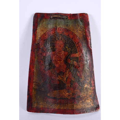 390 - A 19TH CENTURY CHINESE TIBETAN PAINTED LACQUERED SHIN BONE depicting a buddhistic figure standing be... 