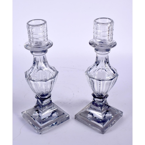 3 - A PAIR OF ANTIQUE GLASS CANDLESTICKS possibly George III. 23.5 cm high.