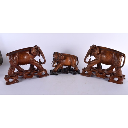 395 - THREE 19TH CENTURY CHINESE CARVED HARDWOOD WOOLLY MAMMOTH ELEPHANTS Qing. Largest 27 cm x 22cm. (3)